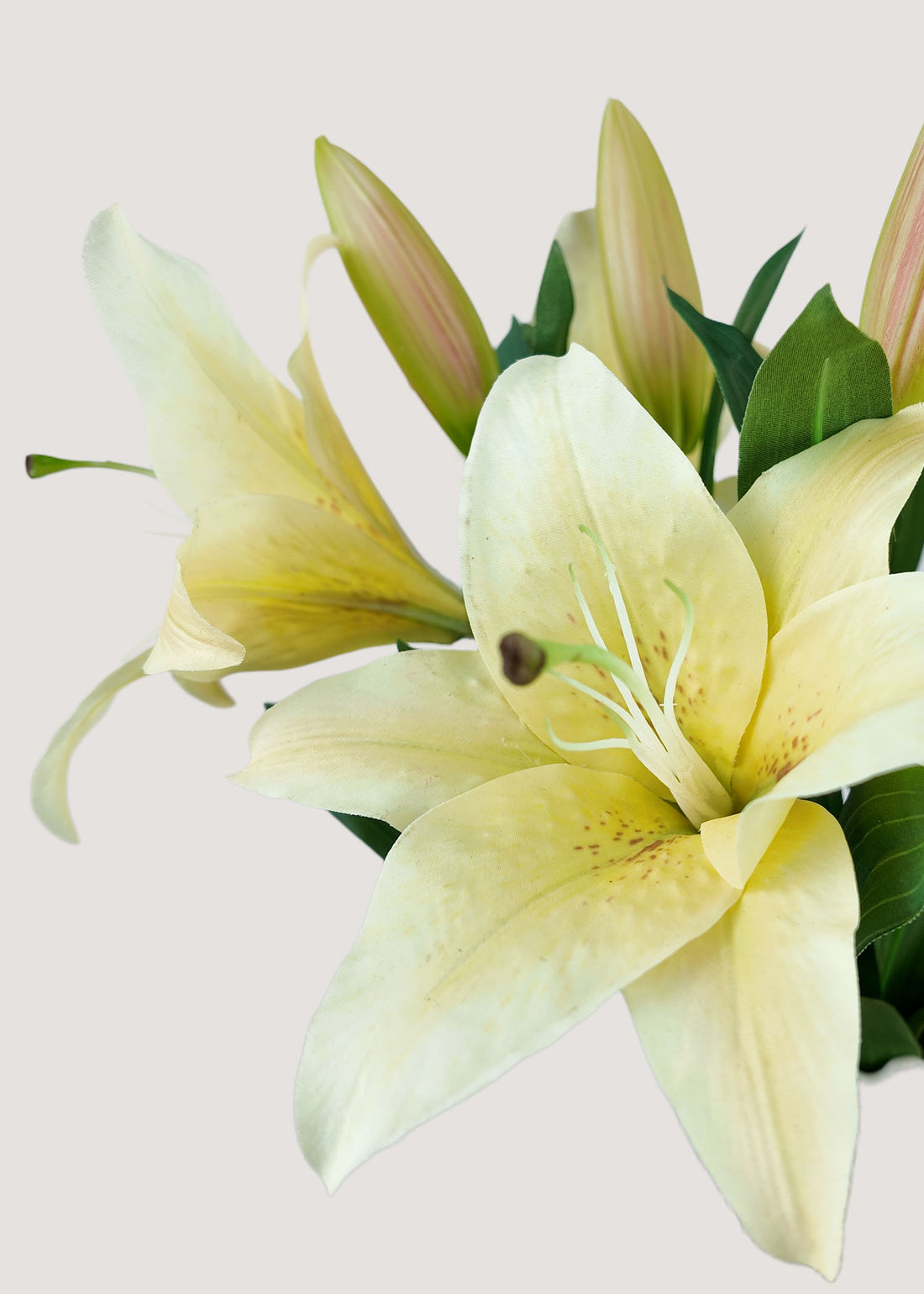 Close-up of real touch pale yellow faux lily petals