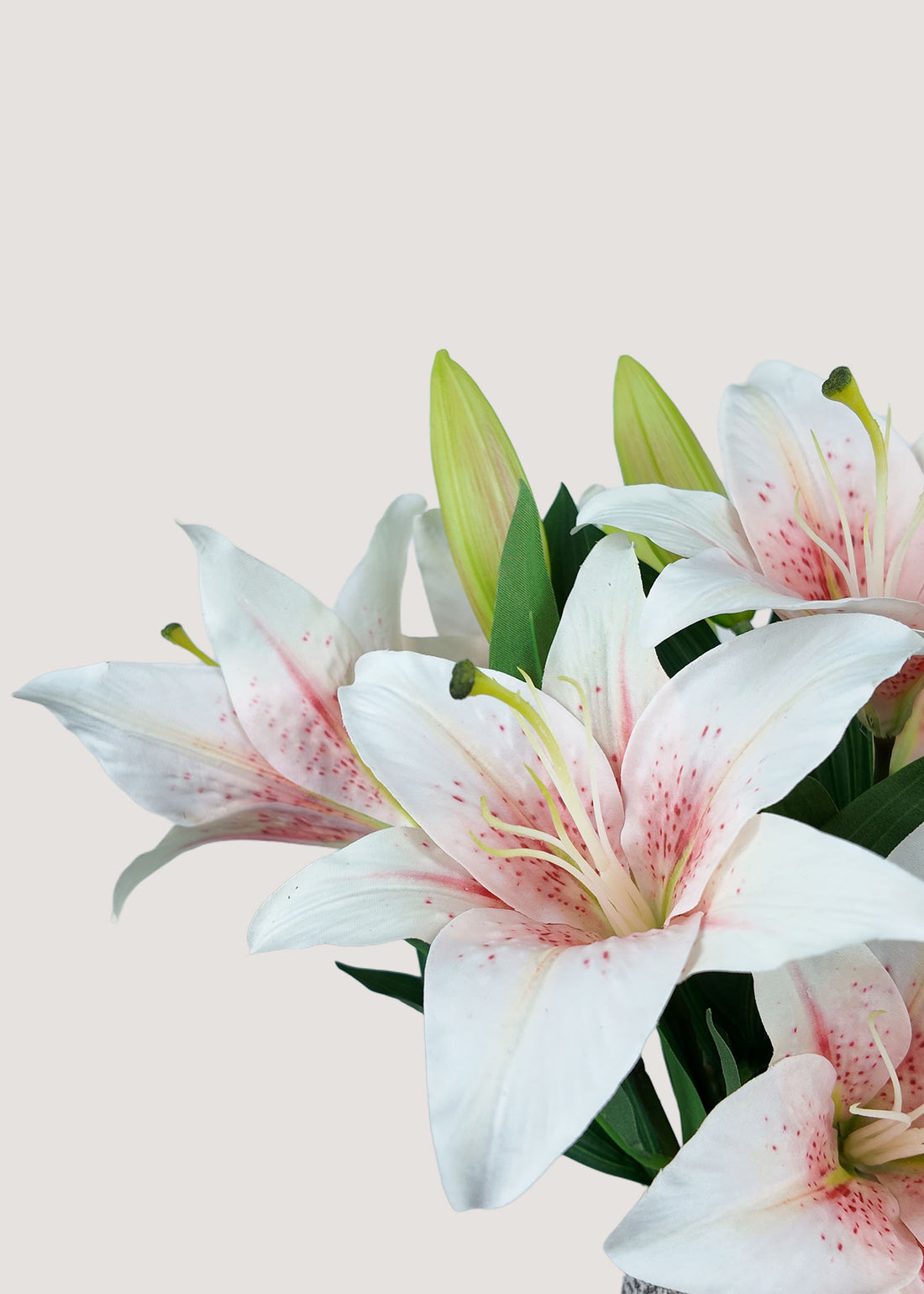 Close-up of real touch pink and white faux lily petals