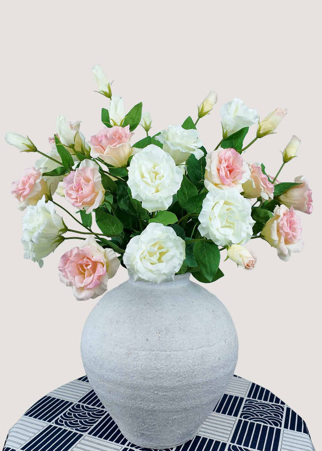 White and pink artificial lisianthus flower bouquet in vase