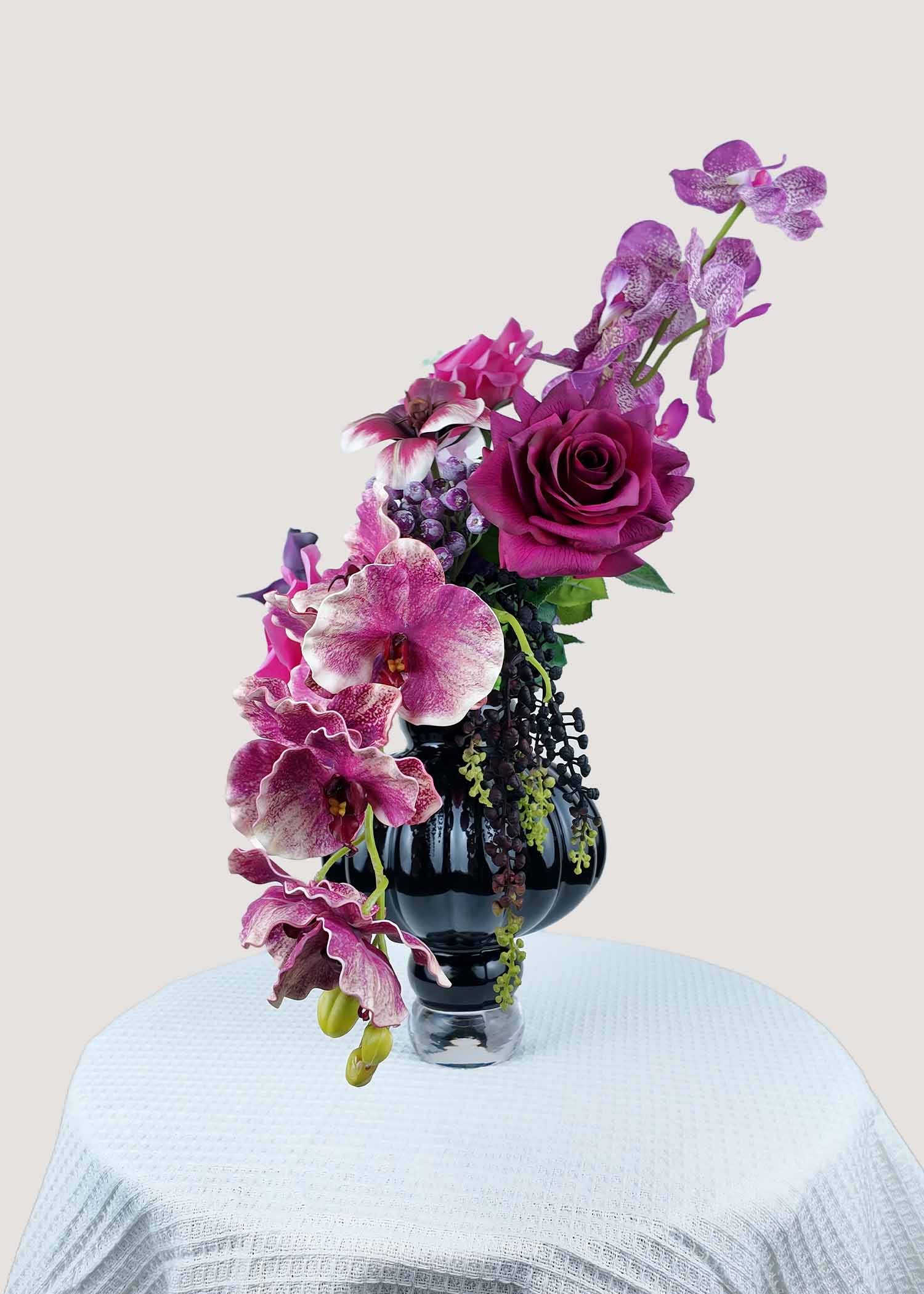 Right side view of luxury faux rose, orchid, and calla lily arrangement