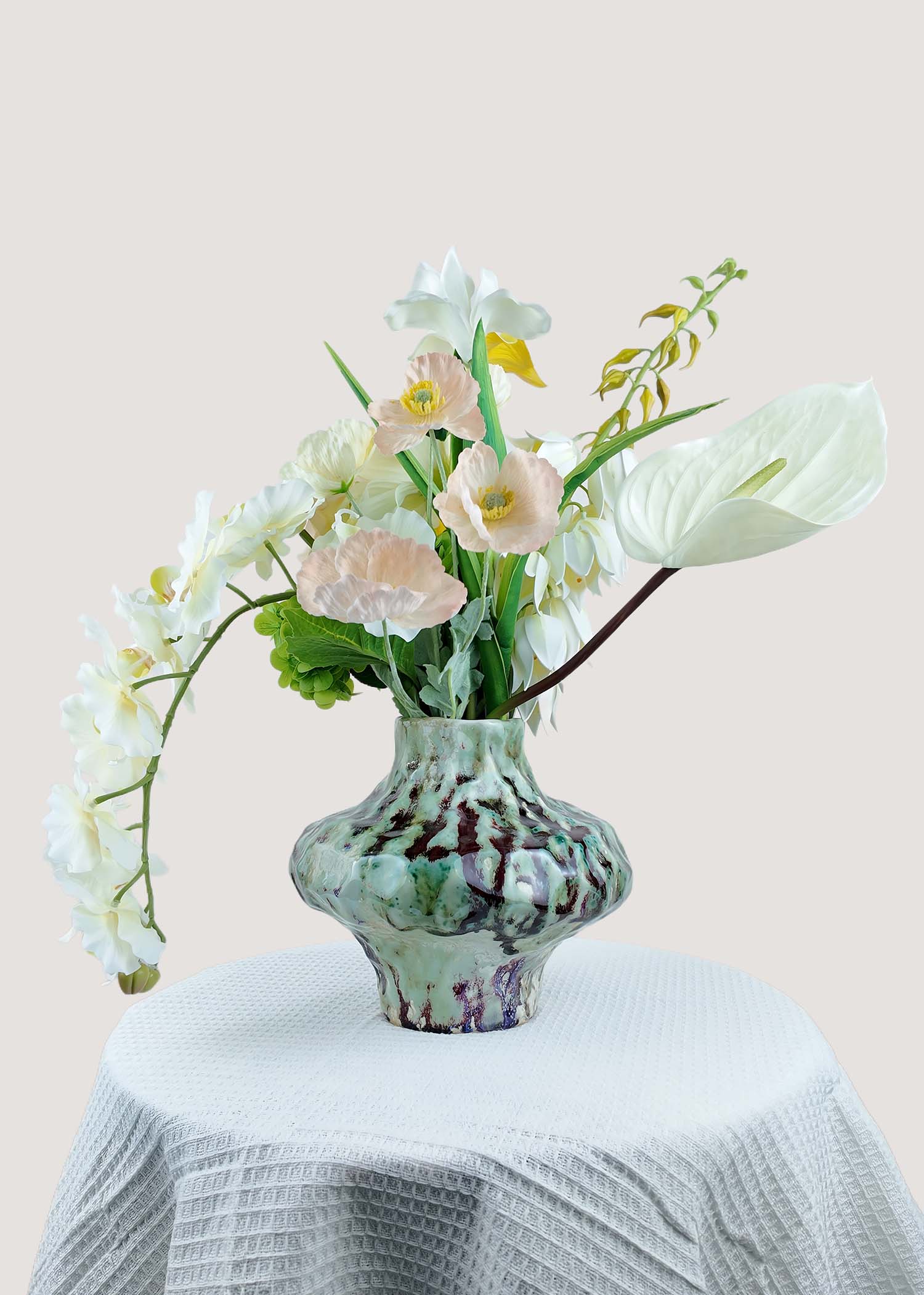 Back view of real touch white lilies and faux anthurium floral arrangement
