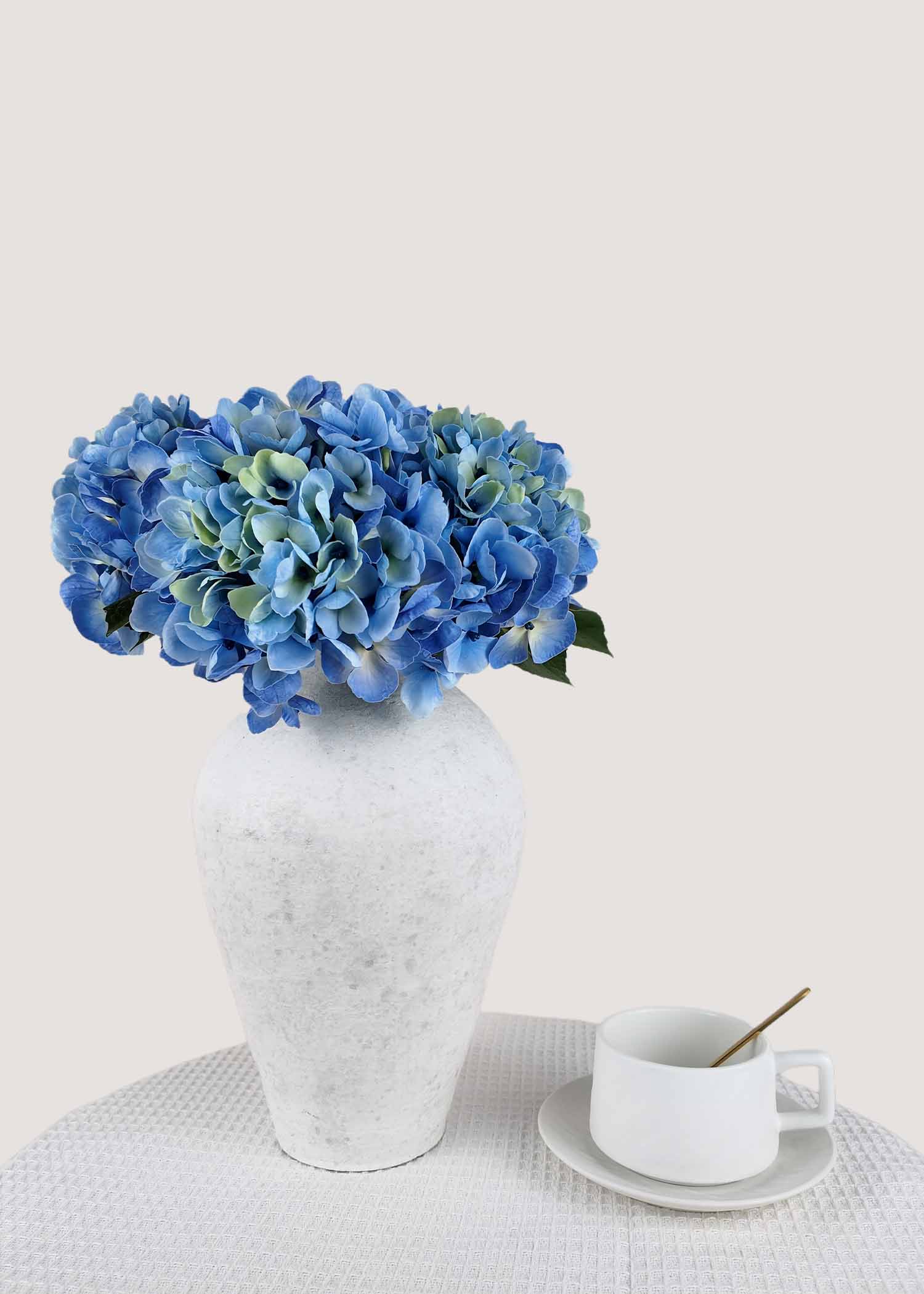 Artificial blue hydrangea bouquet with realistic faux blooms