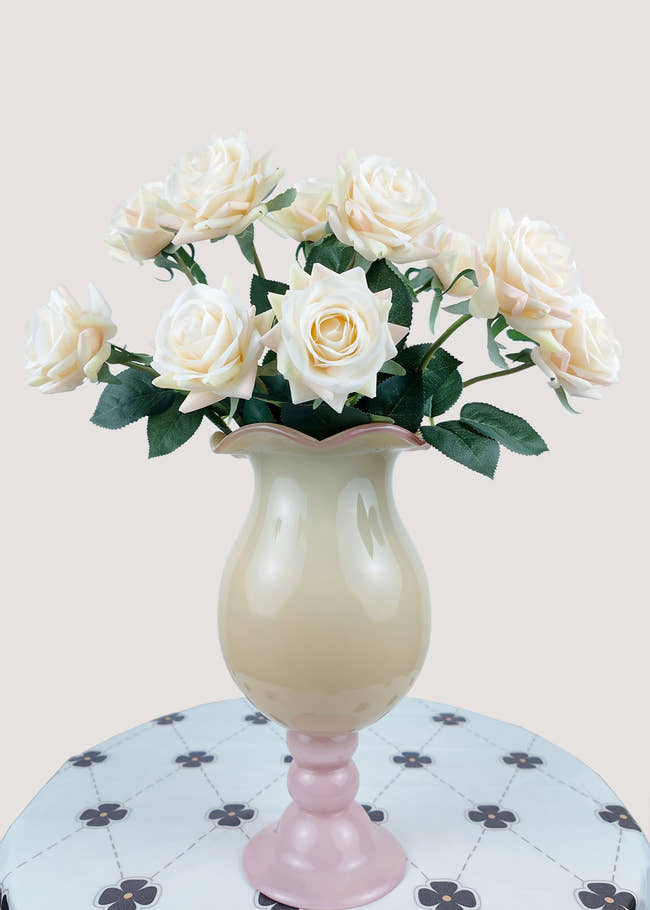 Main view of cream white artificial rose bouquet in vase with green leaves