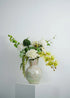 Deluxe white and green faux floral arrangement featuring orchids, roses, and hydrangeas in a rustic ceramic vase – Everblooma luxury artificial flowers