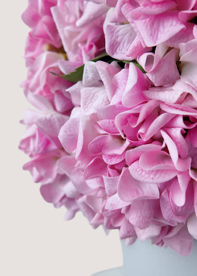 Close-up of artificial pink hydrangea petals with natural detail