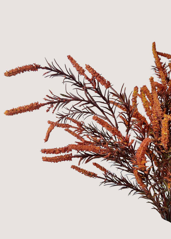 Close-up of textured burnt orange artificial blooms with natural details