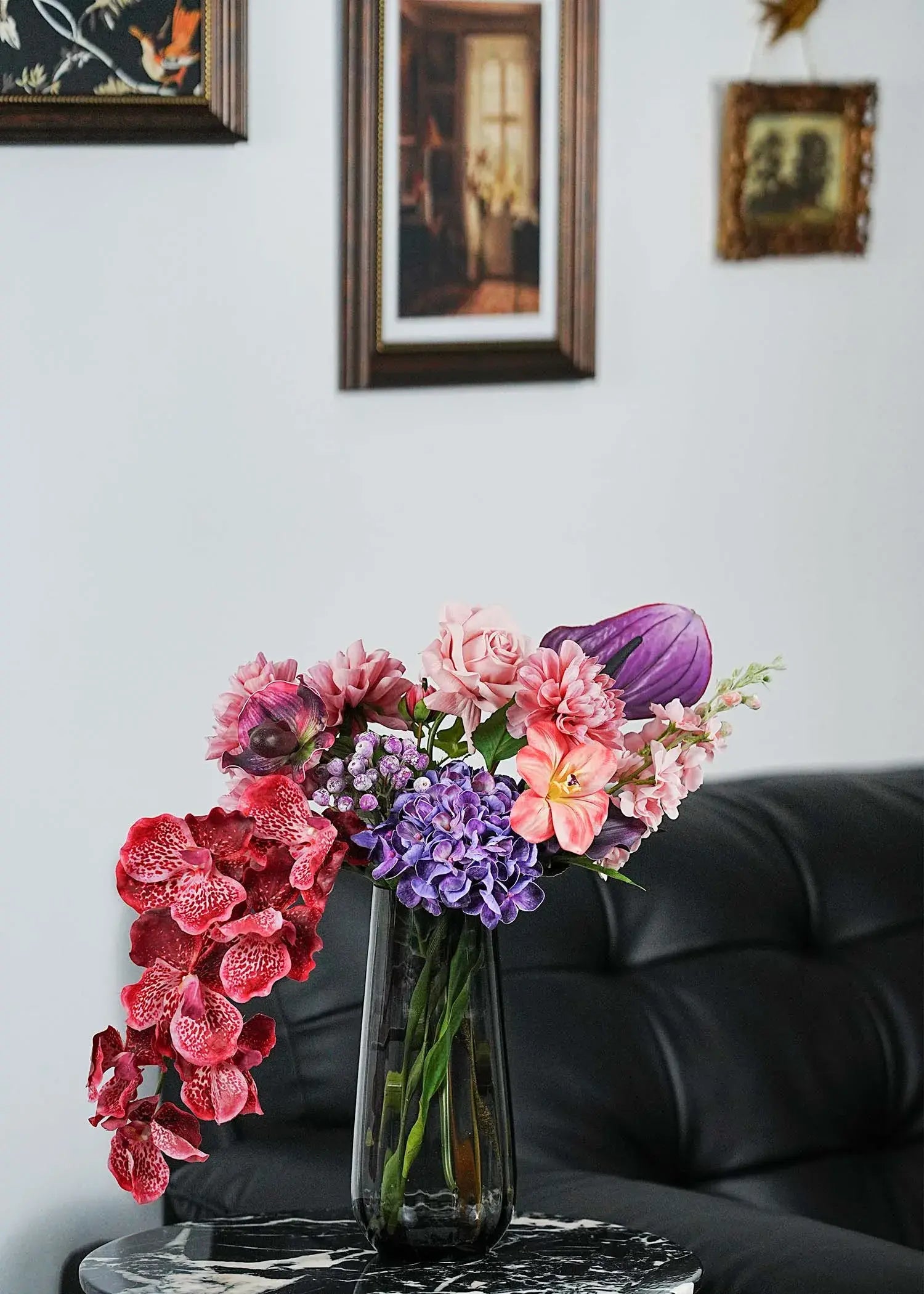 Elegant burgundy rose and orchid artificial flower arrangement displayed in a cozy living room interior – Everblooma luxury faux floral décor
