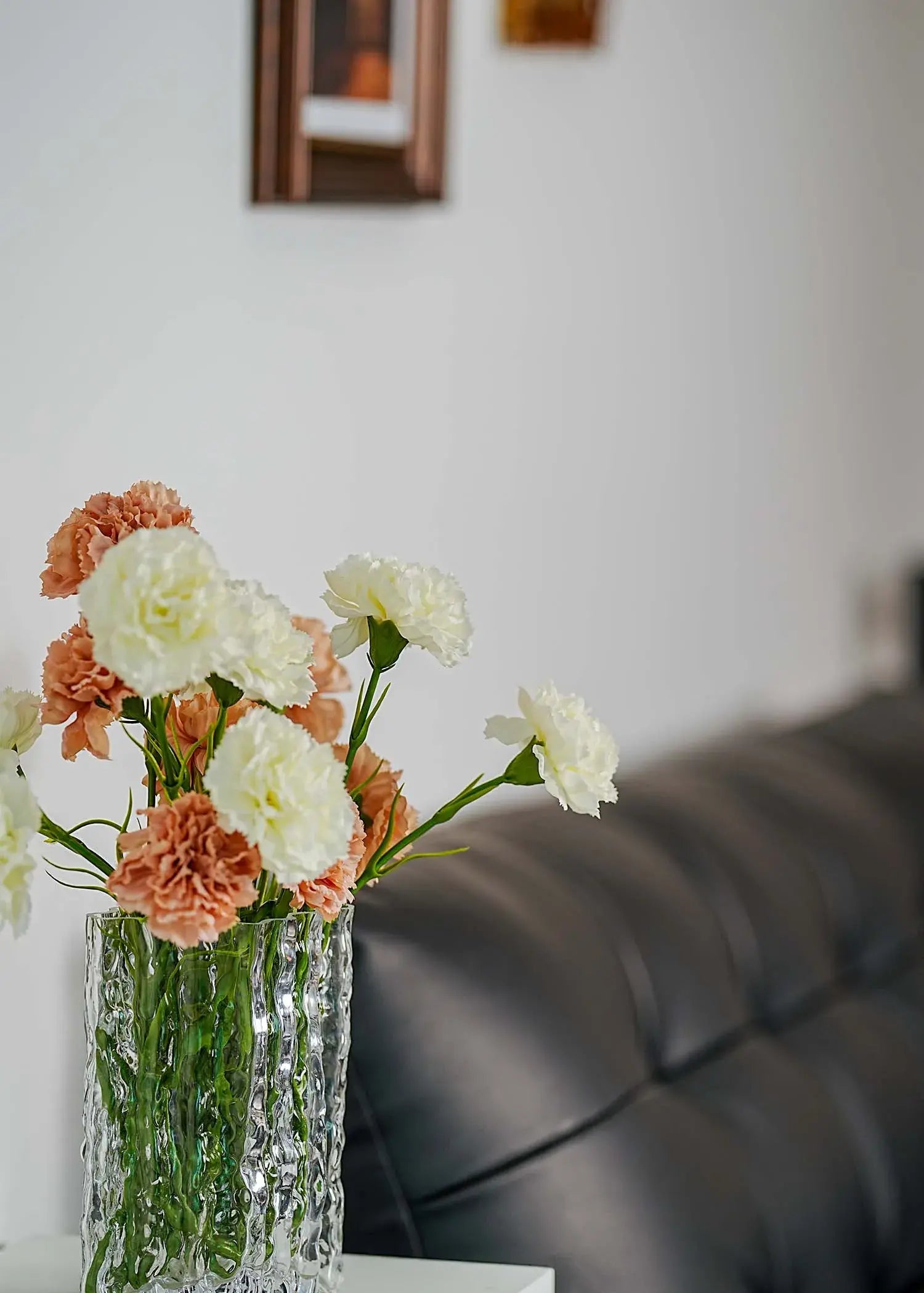 Realistic faux carnation flower arrangement blending soft ivory and nude tones, lifelike artificial flowers for interior decoration