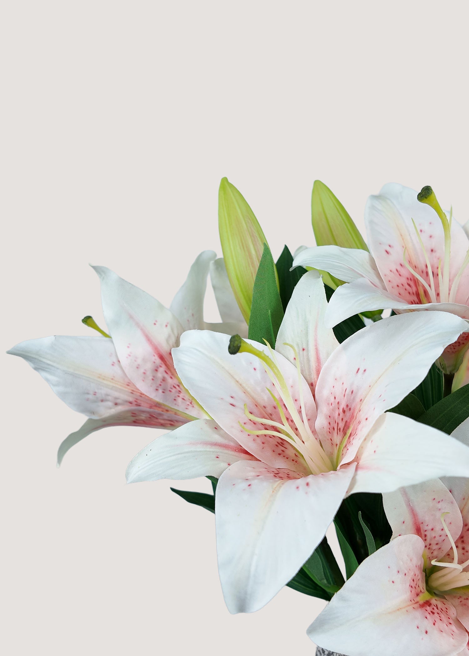 Close-up of real touch pink and white faux lily petals