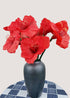 Red amaryllis artificial flower bouquet in vase