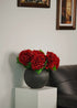 Close-up of silk deep red hydrangea blooms showcasing realistic texture and vibrant color, perfect artificial flower arrangement for living spaces