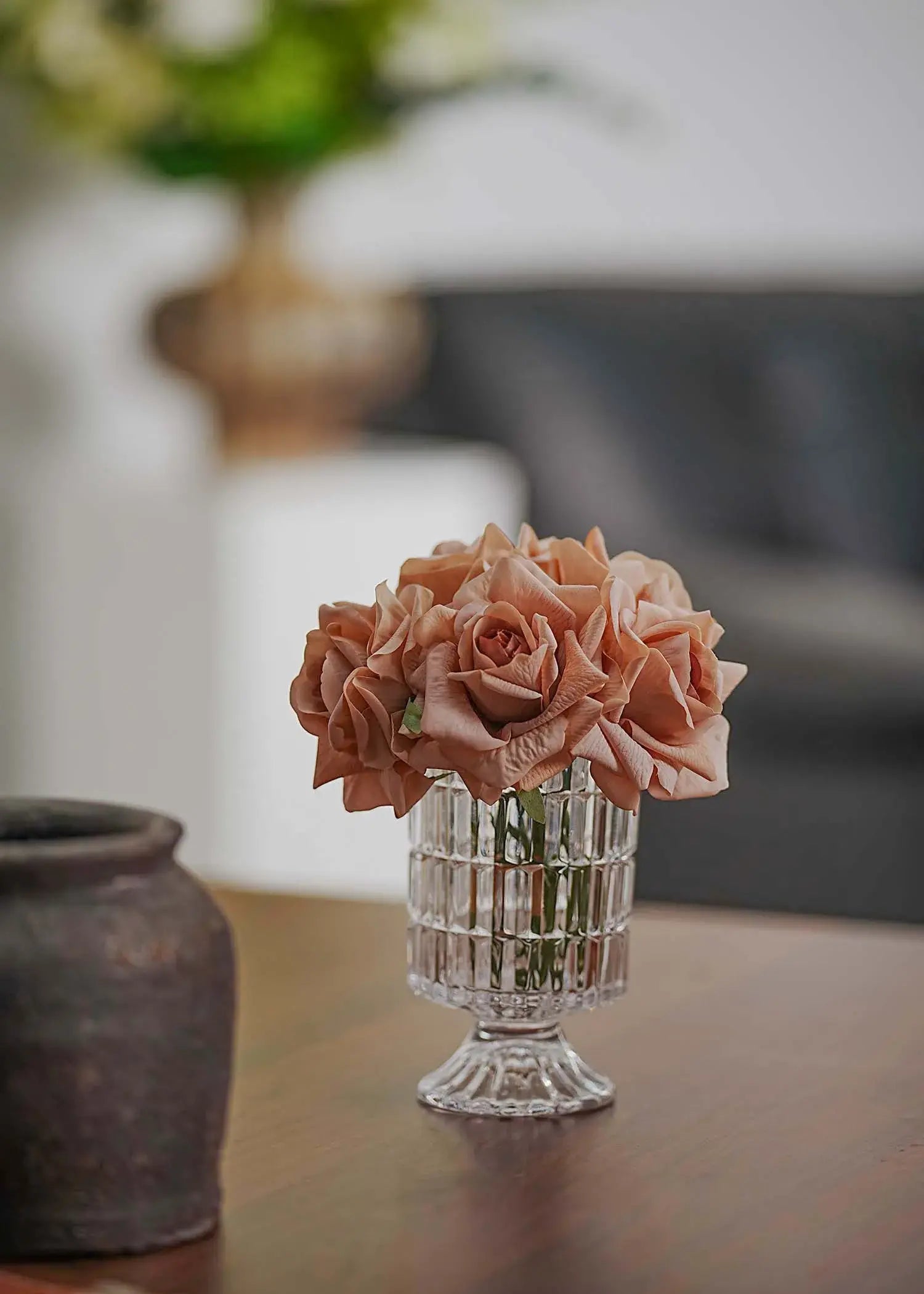 Vintage mauve artificial rose bouquet in crystal vase on wooden table, modern living room accent piece