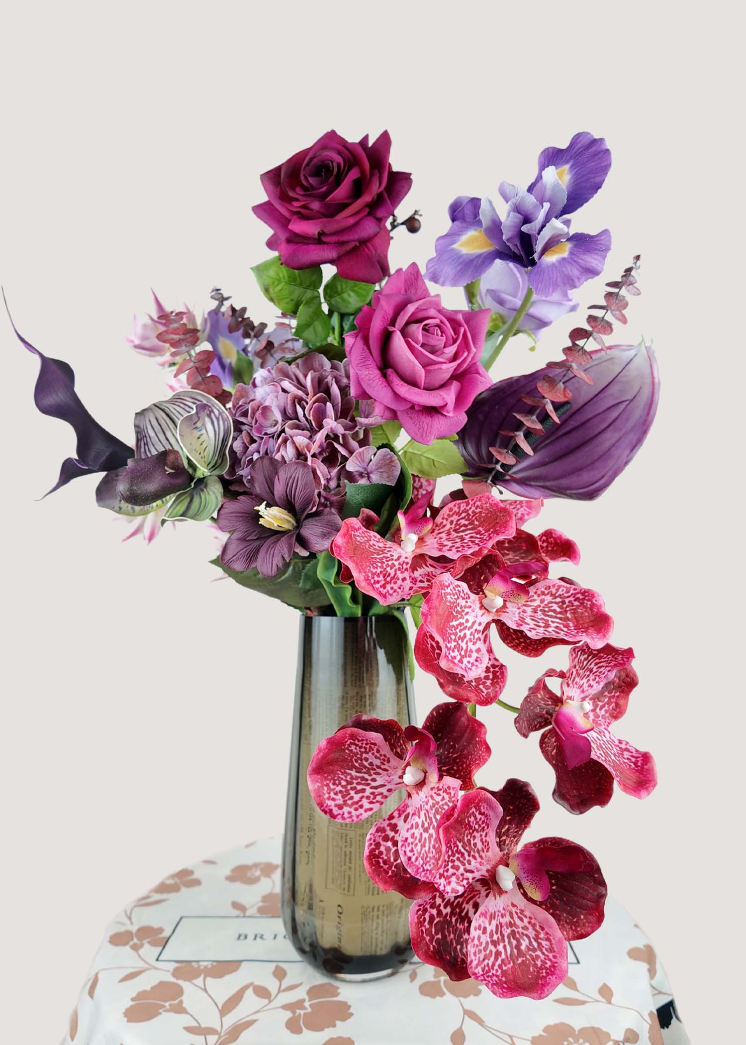 Burgundy rose and orchid artificial flower arrangement with purple accents