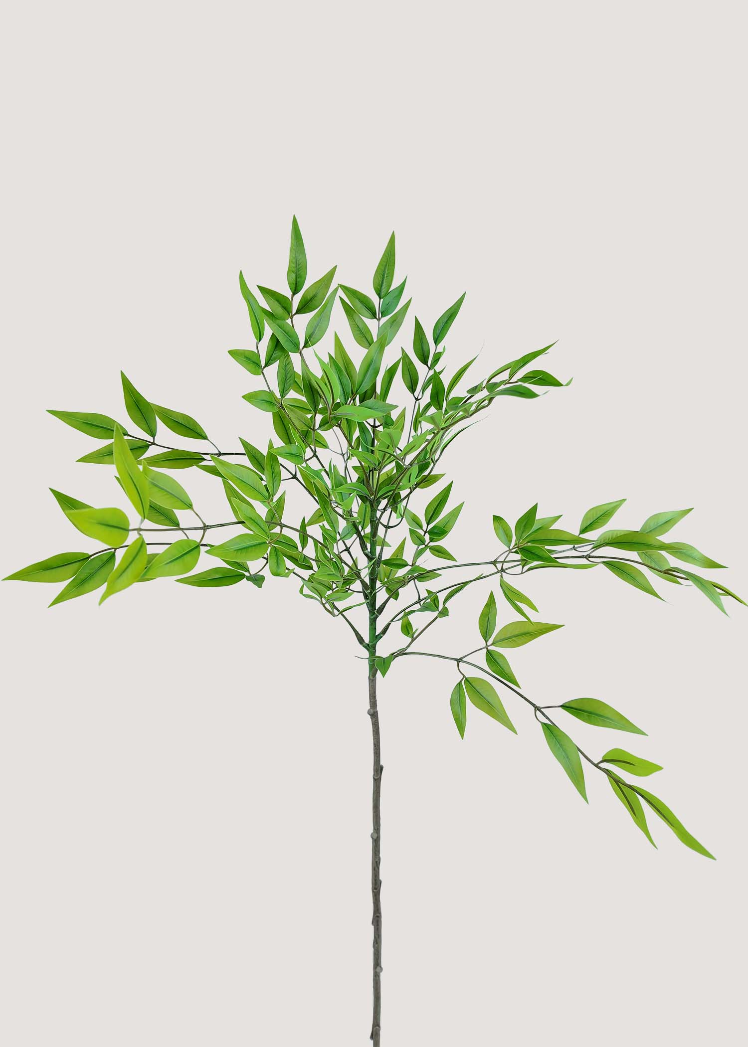 Artificial green leaf branch with lush foliage