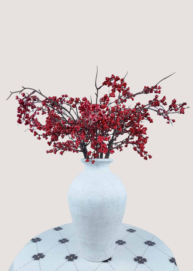 Artificial red berry bouquet for winter and Christmas décor
