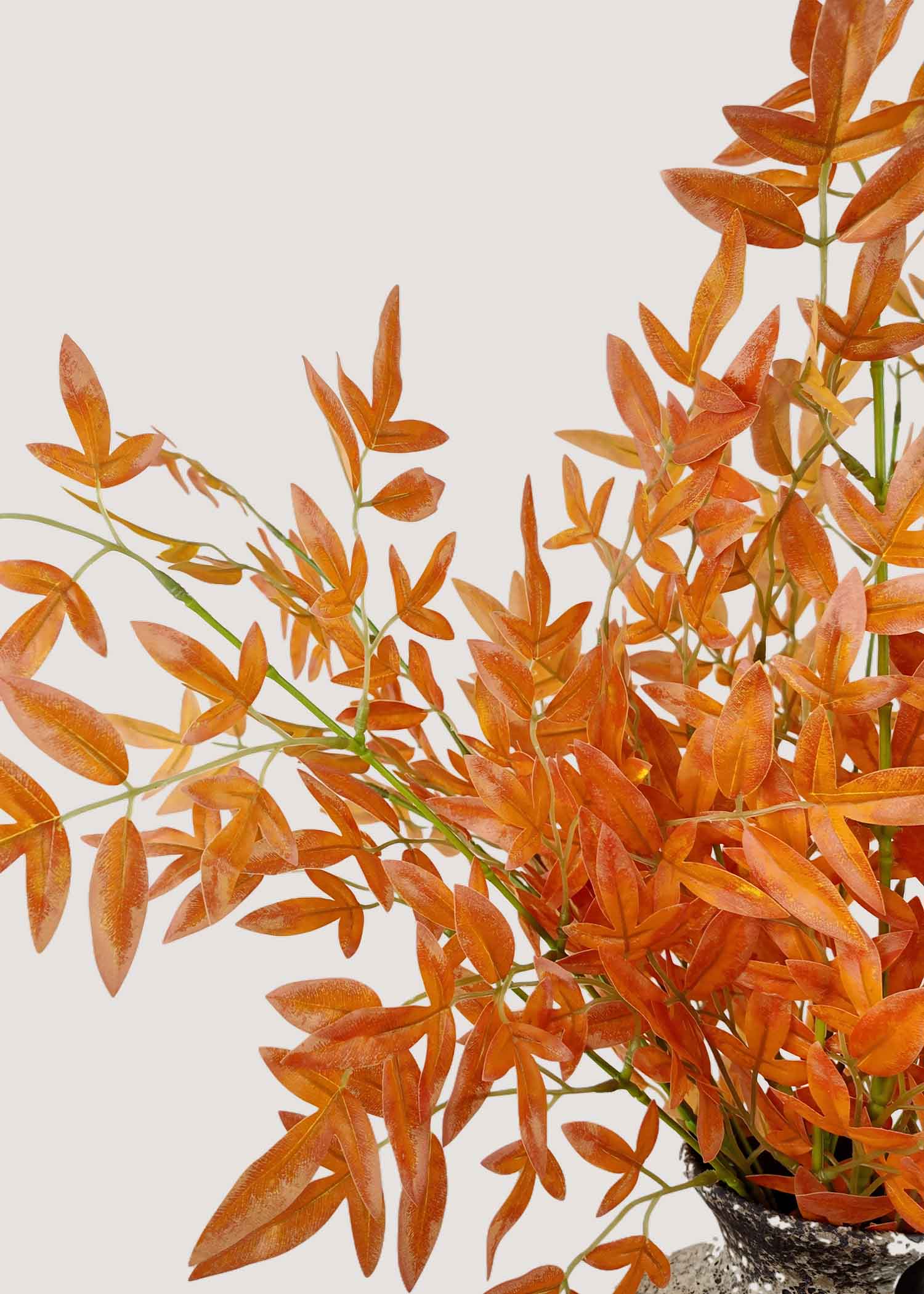 Closeup of vibrant orange artificial leaves for fall arrangements