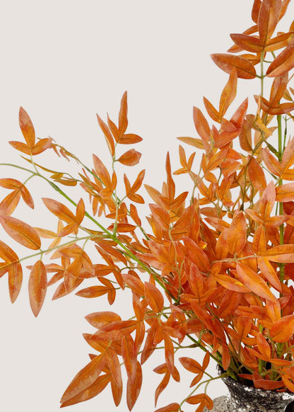 Closeup of vibrant orange artificial leaves for fall arrangements