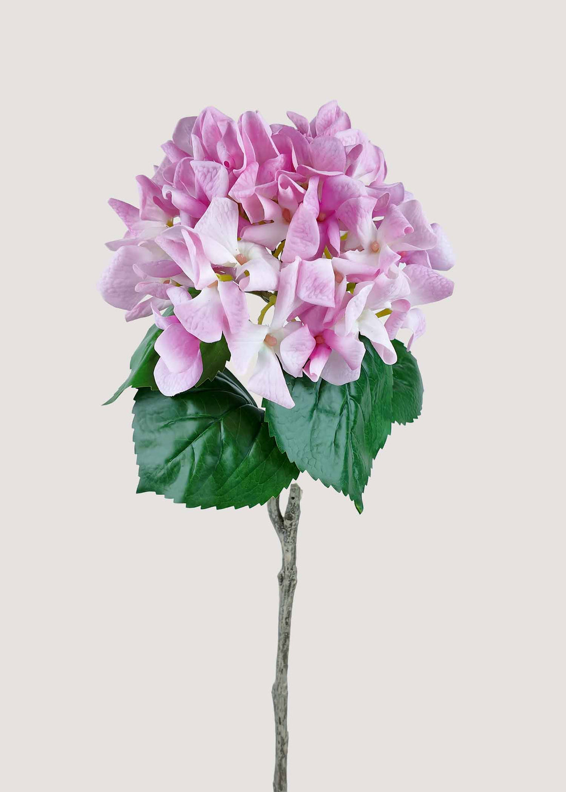 Blush pink artificial hydrangea stem with realistic root and natural foliage, perfect faux flower for home décor.