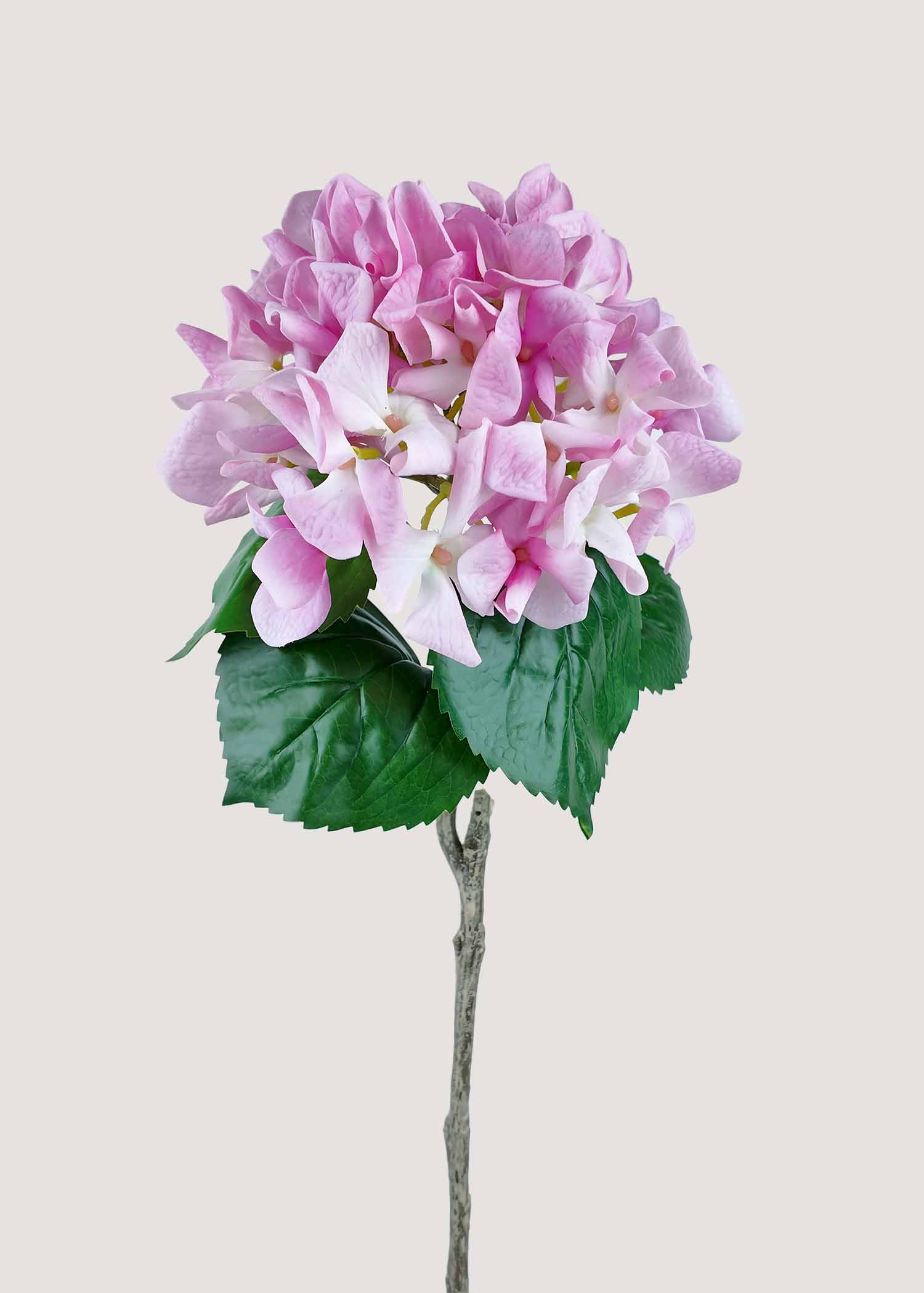 Blush pink artificial hydrangea stem with realistic root and natural foliage, perfect faux flower for home décor.