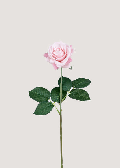 Soft pink artificial rose stem with lifelike petals and green leaves
