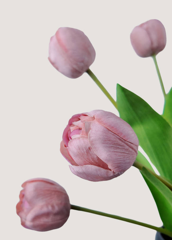 Close-up of pink artificial tulip bloom with realistic petal texture