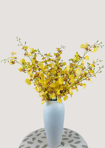 Yellow artificial Dancing Lady orchid bouquet in vase for home decor